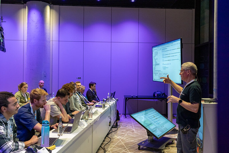 Flink Forward 2024 bootcamp attendees watch Ken presenting.